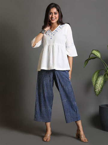 White Cotton Peplum Top with Hand Embroidery Detailing