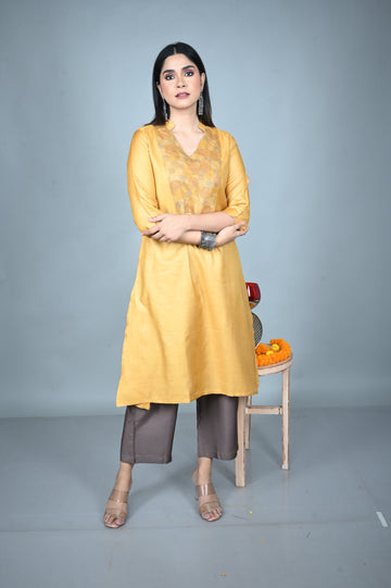 Yellow Tassar A-Line Kurta with Hand Embroidered Yoke and Mud Brown Silk Blend Pants Co-ord Set (set of 2)